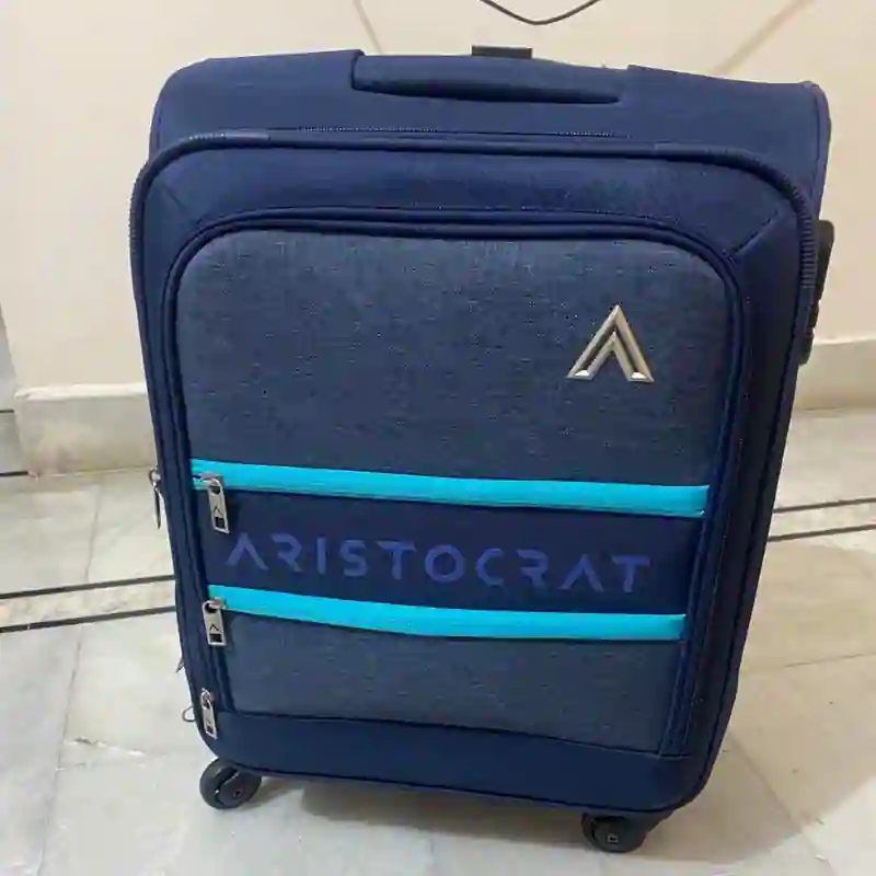 Soft-sided trolley bag with front storage pockets