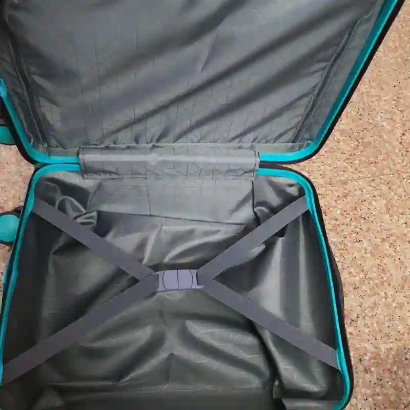 Trolley bag interior with compartments compression straps and laptop sleeve